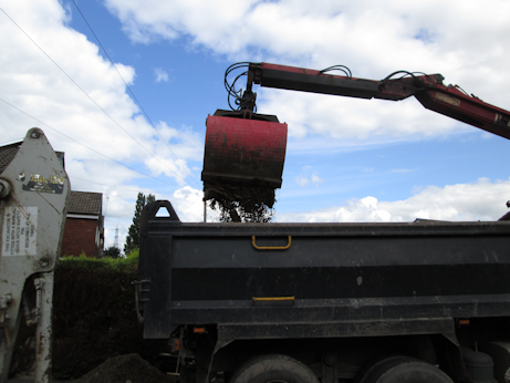 Ground being excavated before concrete installation