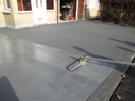 Colour surface hardener being applied