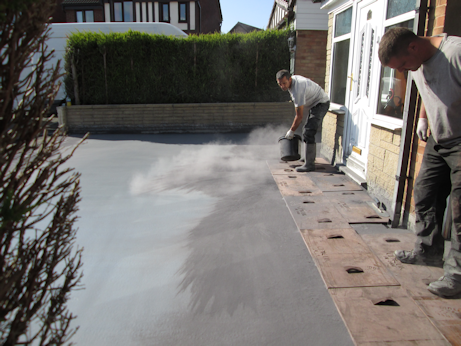 Pattern being imprinted into the concrete