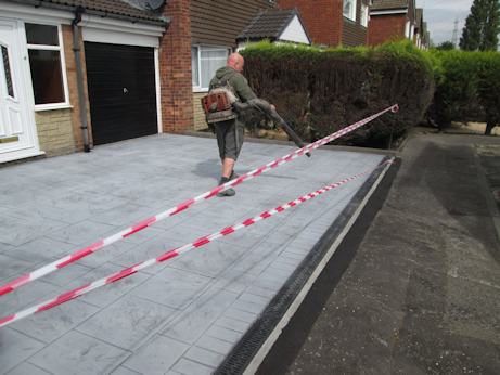 Loose debris being removed before sealing