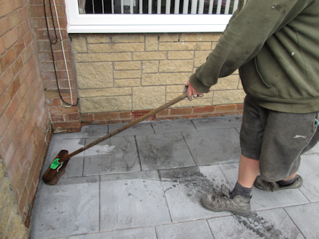 Sealant being applied with brushes