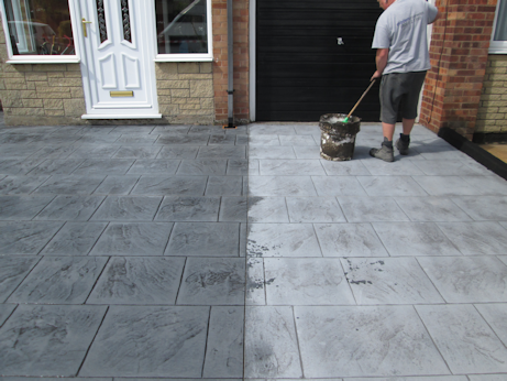 Pattern-imprinted concrete being sealed
